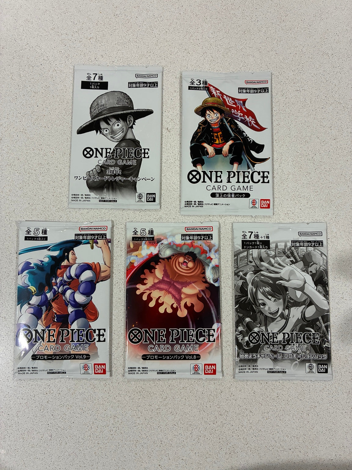 Actual five Japanese One Piece promo packs: 3rd Anniversary Treasure Campaign, Saikyo Jump, Promotion Pack Vol. 8, Vol. 9 and Nami-art Let's Get Started Campaign